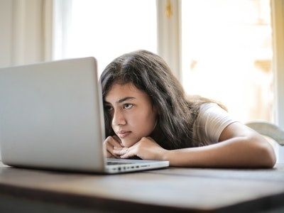 woman thinking about topics for online courses